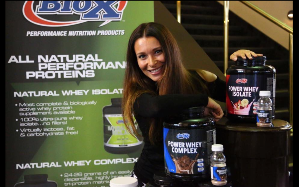 Girl with power whey isolate and power whey complex